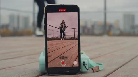 The girl using an iphone for TikTok. Red Helium 8K Stock Footage 143238612
