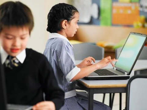 Girl Using Laptop In Class 写真素材