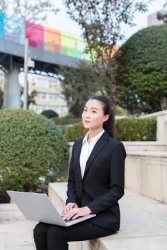 Girl using a laptop computer Stock Photos