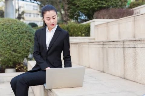 Girl using a laptop computer Stock Photos