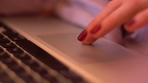 Girl is using laptop, hand on touchpad, close-up. Stock Footage 73545544