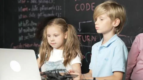 Girl using laptop programing engineering code and writing program. Erudition. Foto stock