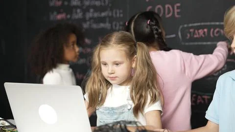 Girl using laptop programing engineering code and writing program. Erudition. Foto stock