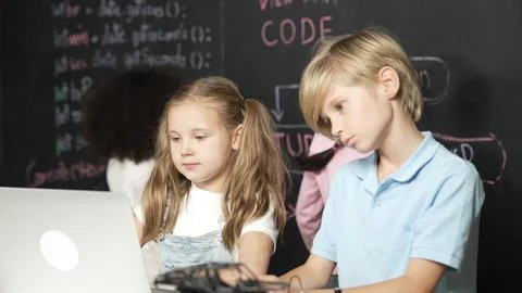 Girl using laptop programing engineering code and writing program. Erudition. Foto stock