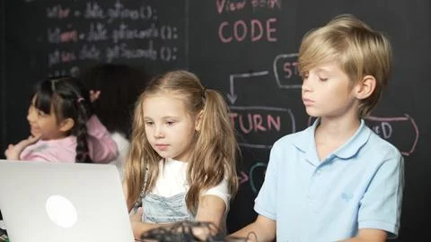 Girl using laptop programing engineering code and writing program. Erudition. Photos