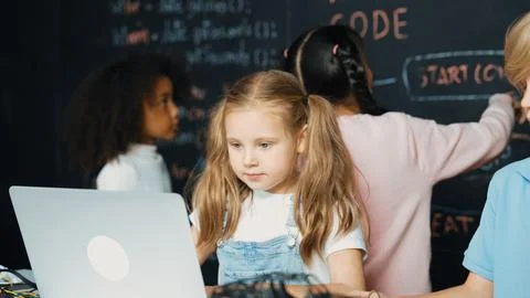 Girl using laptop programing engineering code and writing program. Erudition. Foto stock