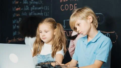 Girl using laptop programing engineering code and writing program. Erudition. Photos