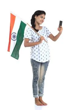 Girl using mobile with Indian flag or tricolour on white background, Indian.. Stock Photos