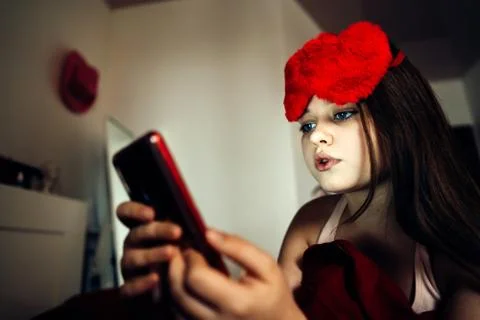 Girl using mobile phone for making portrait and sending virtual message Stock Photos