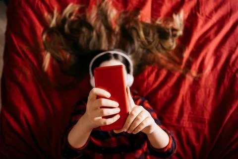 Girl using mobile phone for making portrait and sending virtual message Stock Photos