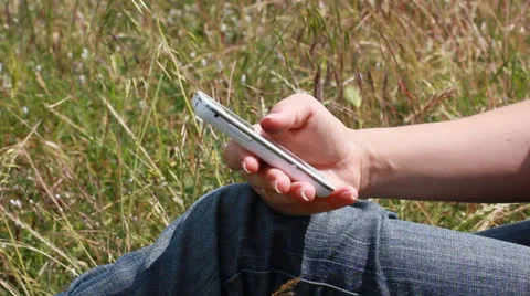 Girl using mobile phone for text messaging Stock Footage 24509647