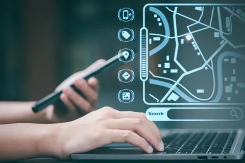 Girl using online map technology To find the location and location via lapt.. Stock Photos