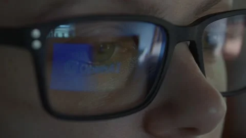 Girl using Open AI Chat GPT. Reflection in glasses. Close up. Stock Footage 241720090