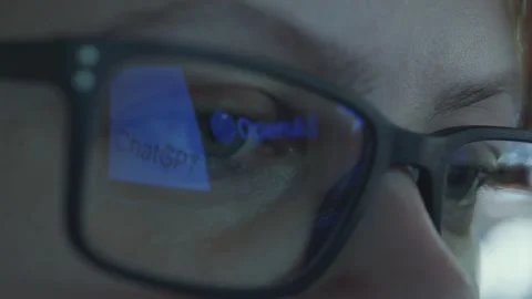 Girl using Open AI Chat GPT. Reflection in glasses. Close up. Stock Footage 241720109