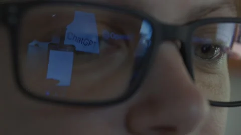 Girl using Open AI Chat GPT. Reflection in glasses. Close up. Stock Footage 241720153