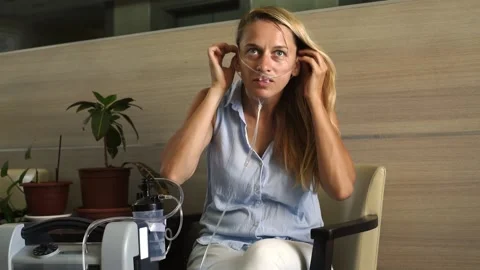 Girl using Oxygen breathing machine Stock Footage 155483619