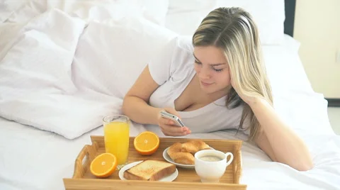 Girl using phone in bed Video stock 59222025
