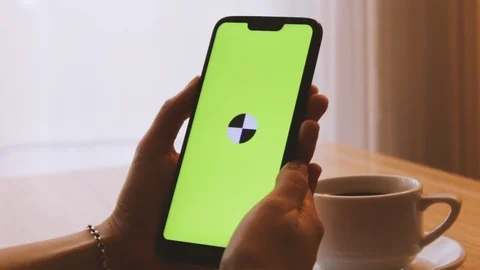 Girl using phone on a coffee table Stock Footage 125347873