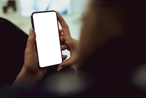 Girl using smartphone blank screen frameless modern design while lying on the Illustrazione stock
