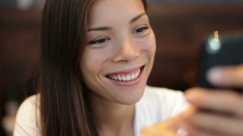 Girl using smartphone in cafe Stock Footage 30140701
