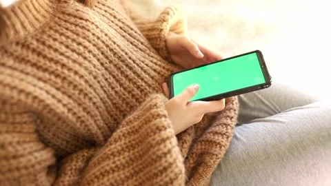 Girl Using Smartphone with chroma key screen Stock Footage 164940823