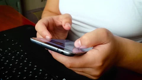 Girl using smartphone close up sliding screen, surfing internet, social media Stock Footage 164181791