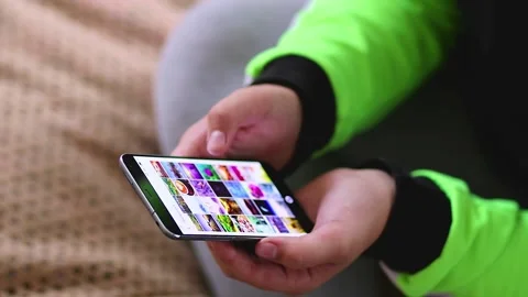 Girl using smartphone close up sliding screen, surfing internet, social media Stock Footage 164181818