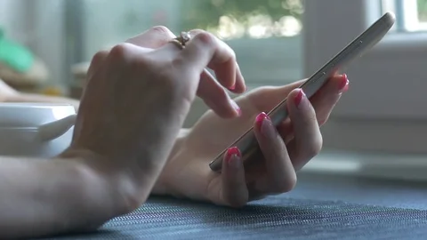Girl using smartphone in hands Stock Footage 79024750