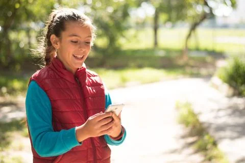 Girl using smartphone Stock Photos