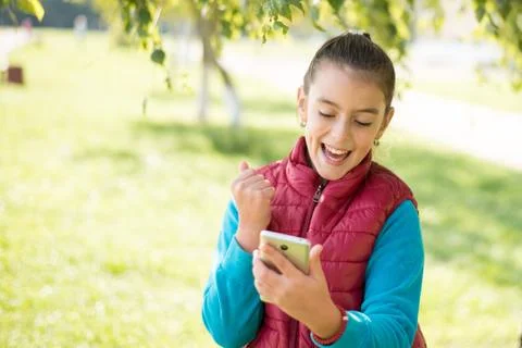 Girl using smartphone Stock Photos