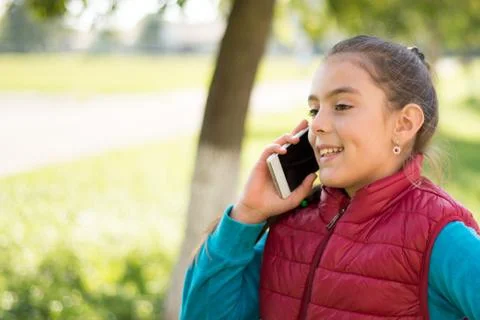 Girl using smartphone Stock Photos