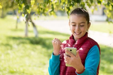 Girl using smartphone Stock Photos