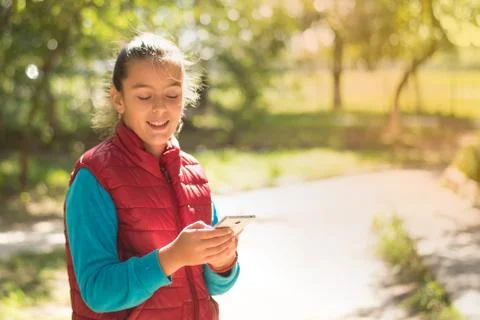 Girl using smartphone Stock Photos