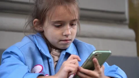 The girl using smartphone. playing games or looking information Stock Footage 256162286