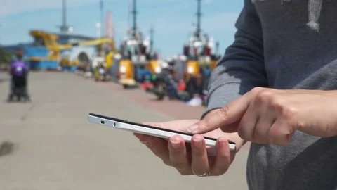 A girl using a smartphone at seaside Stock Footage 75999531