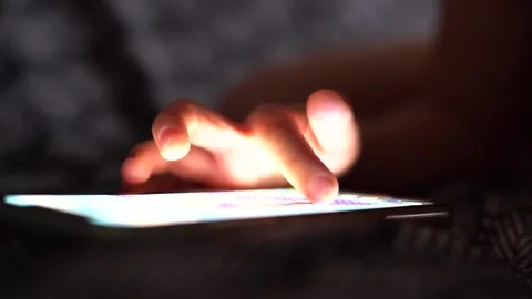 Girl using smartphone, using mobile apps, playing games at home Stock Footage 223351891