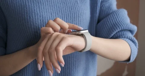 Girl using smartwatch with touchscreen at the office. Stock Footage 104405840