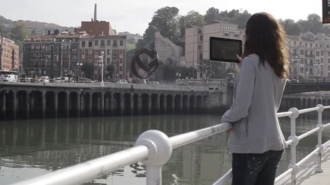 Girl using tablet on city Stock Footage 94545862