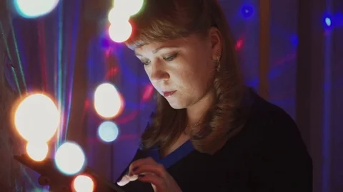 Girl using a tablet computer on Christmas eve close-up Stock Footage 81607396