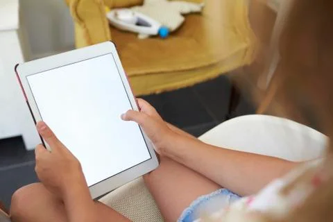 Girl using a tablet computer, close up, crop Stock Photos