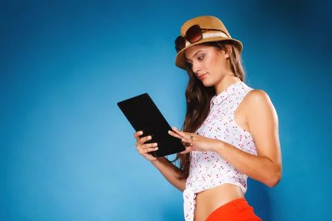 Girl using tablet computer e-book reader. Stock Photos