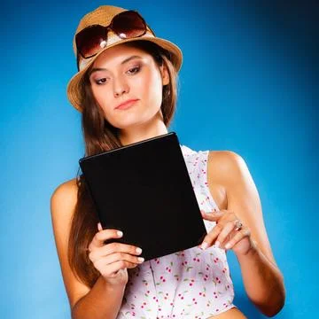 Girl using tablet computer e-book reader. Stock Photos