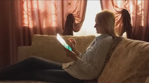 Girl Using Tablet Near Window 1 Stock Footage 58758936