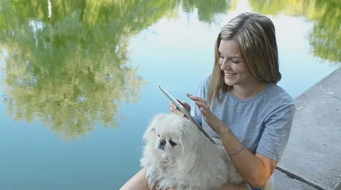 Girl Using Tablet In The Park. Stock Footage 56690255