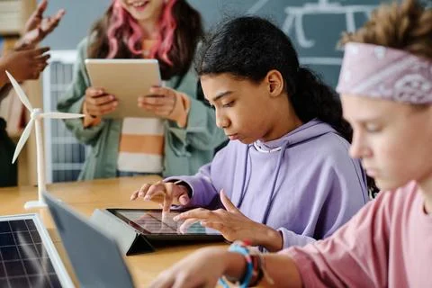 Girl using tablet pc at class 写真素材