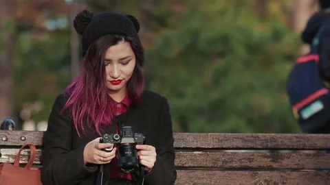 Girl using tablet pc in the park Stock Footage 69735402