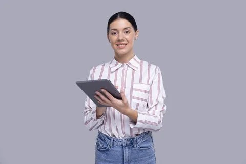 Girl Using Tablet Standing Looking to Camera Isolated. Commecial, Shopping Stock Photos