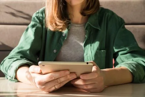 Girl using tablet at table Stock Photos