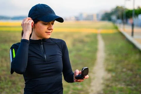 Girl using technologies to have fun in the morning exercise routine Stock Photos