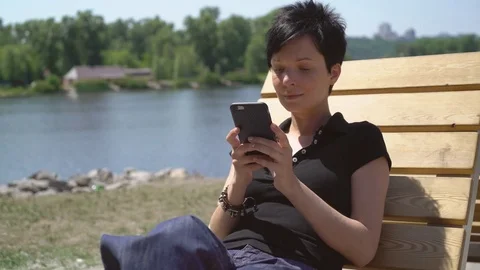 Girl using touch screen cellular Stock Footage